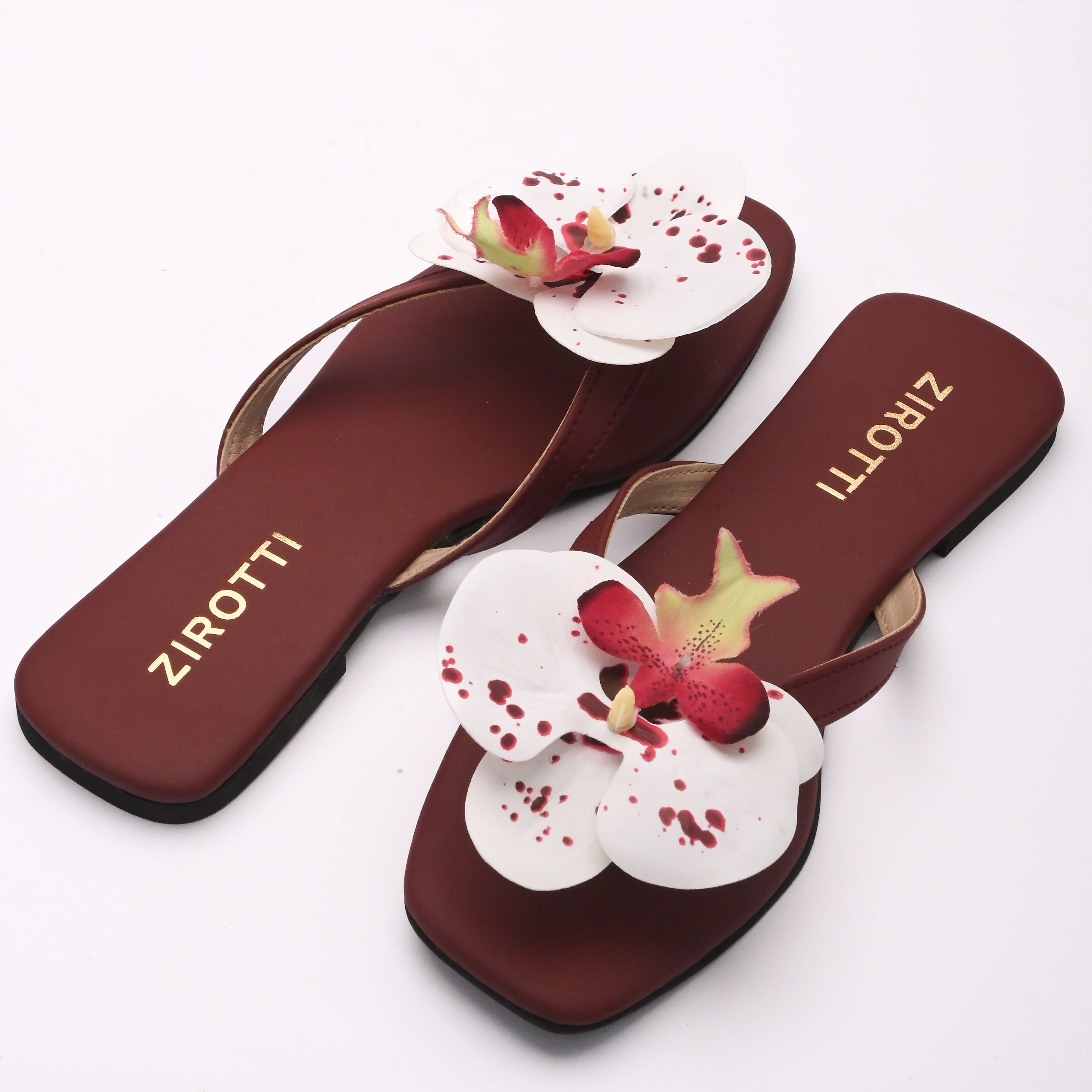Soft maroon sandal with minimal straps and everyday comfort.