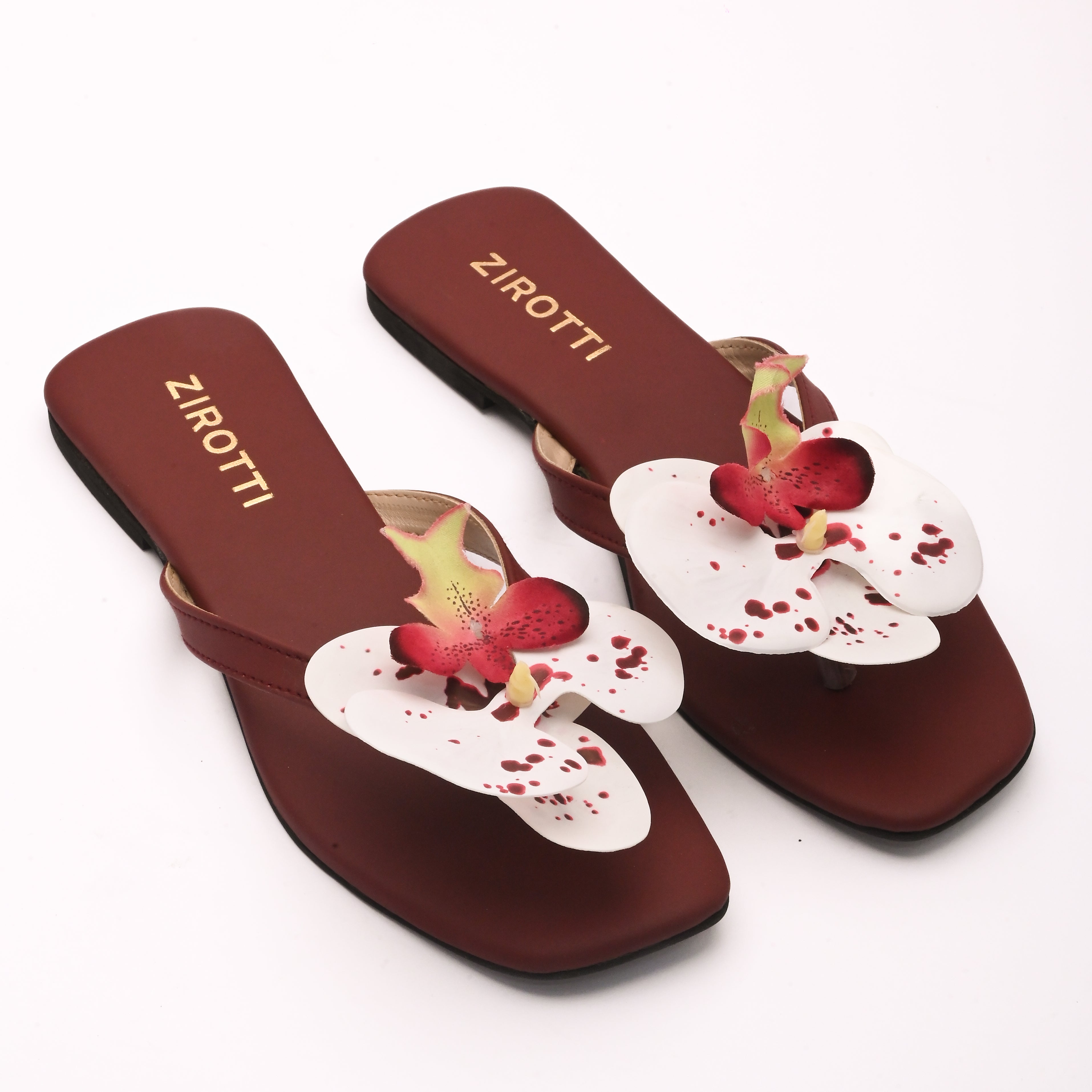 Soft maroon sandal with minimal straps and everyday comfort.