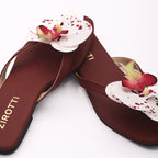 Soft maroon sandal with minimal straps and everyday comfort.