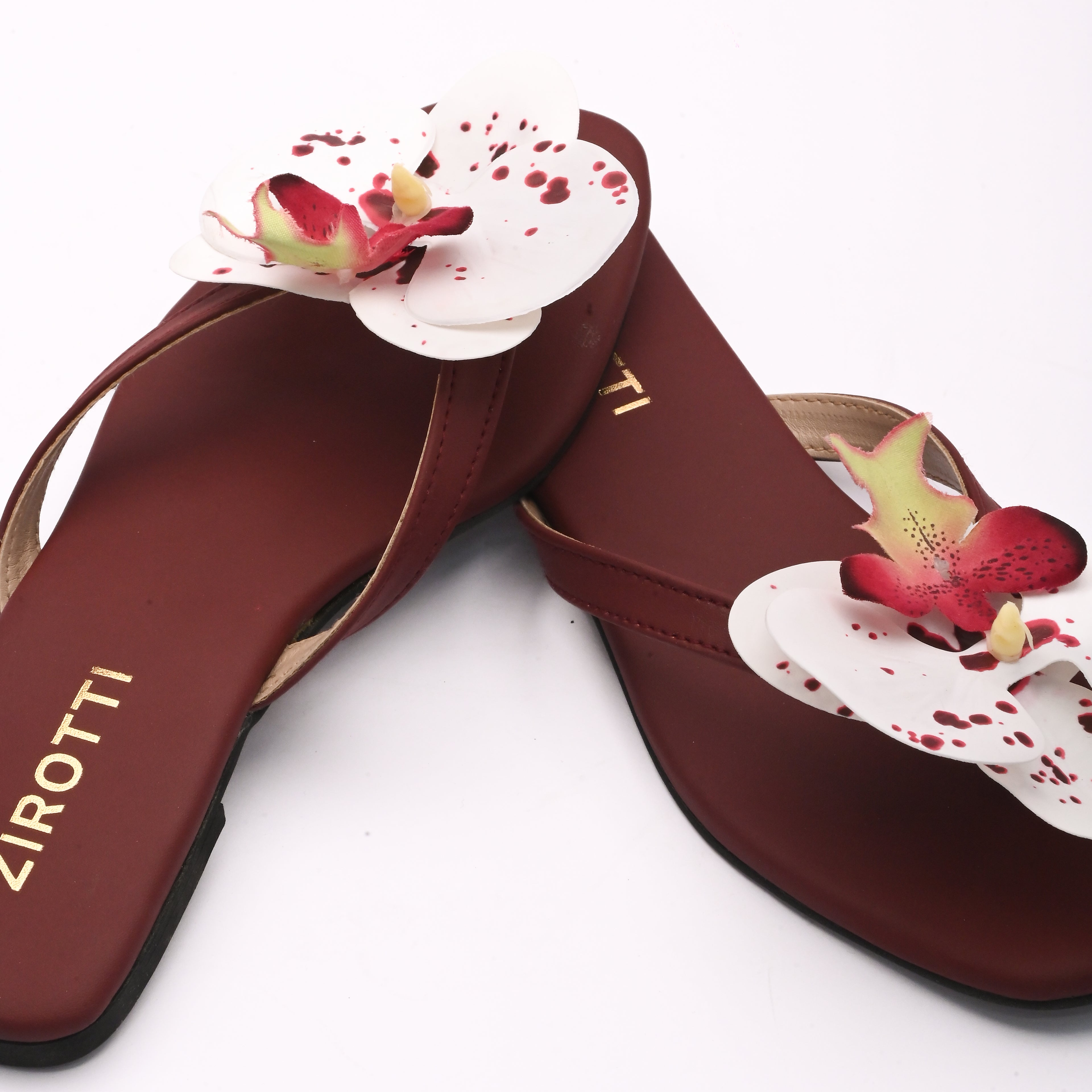 Soft maroon sandal with minimal straps and everyday comfort.