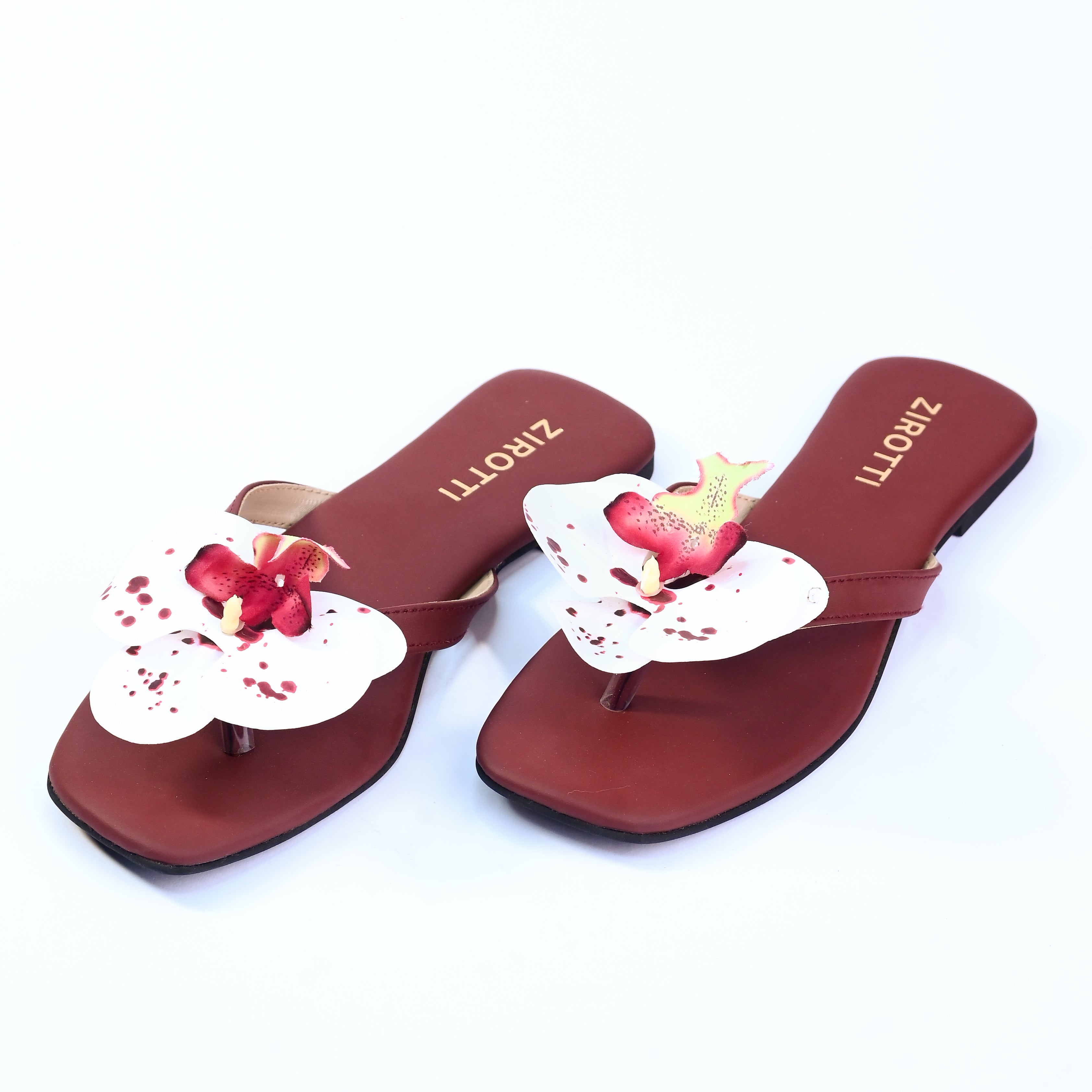 Soft maroon sandal with minimal straps and everyday comfort.