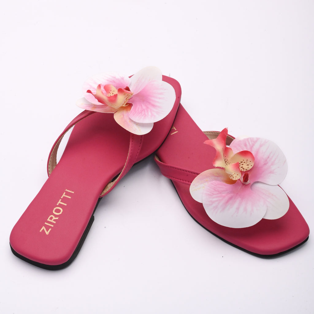 Stylish pink sandals with comfy sole and open-toe design.