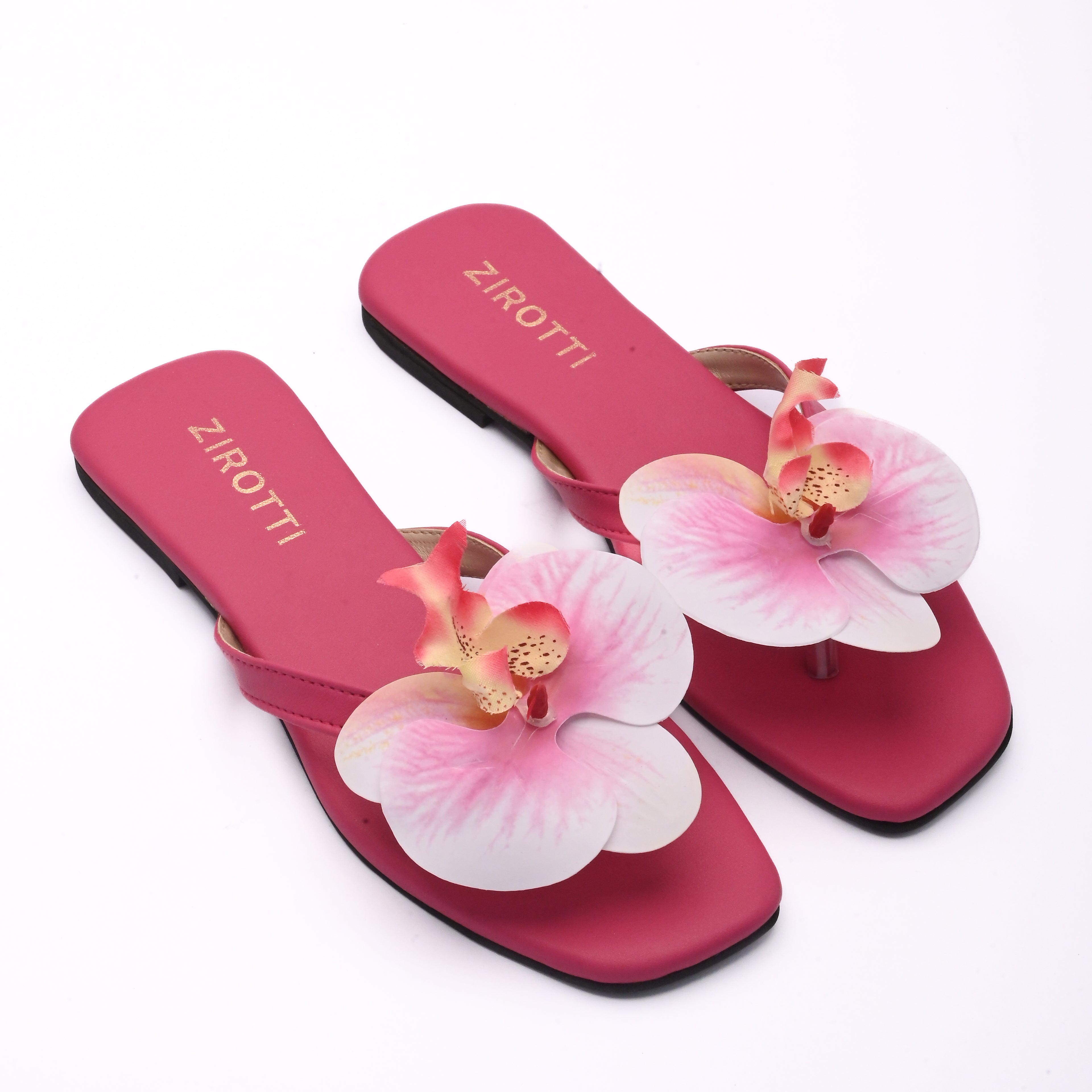 Stylish pink sandals with comfy sole and open-toe design.