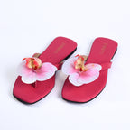 Stylish pink sandals with comfy sole and open-toe design.
