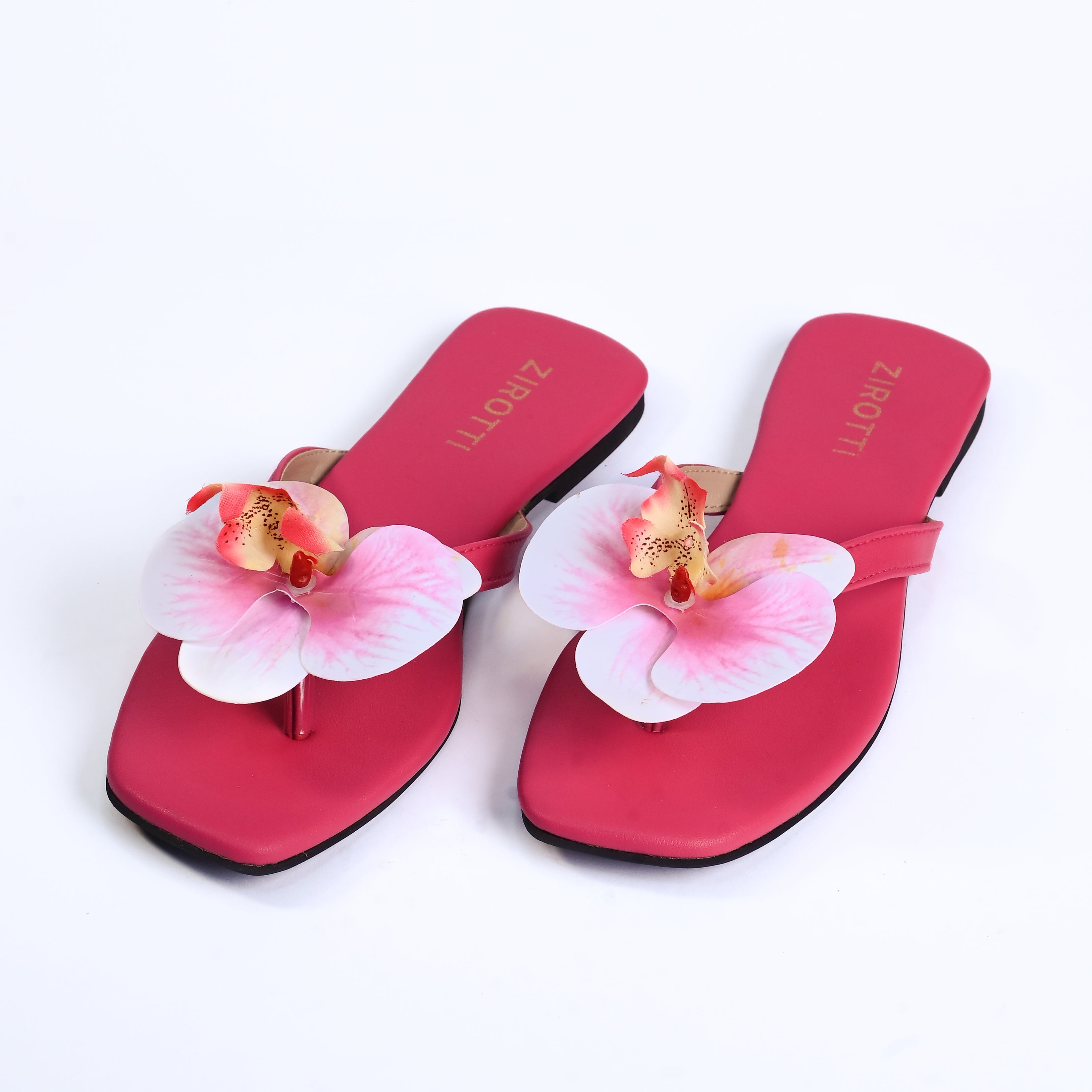 Stylish pink sandals with comfy sole and open-toe design.