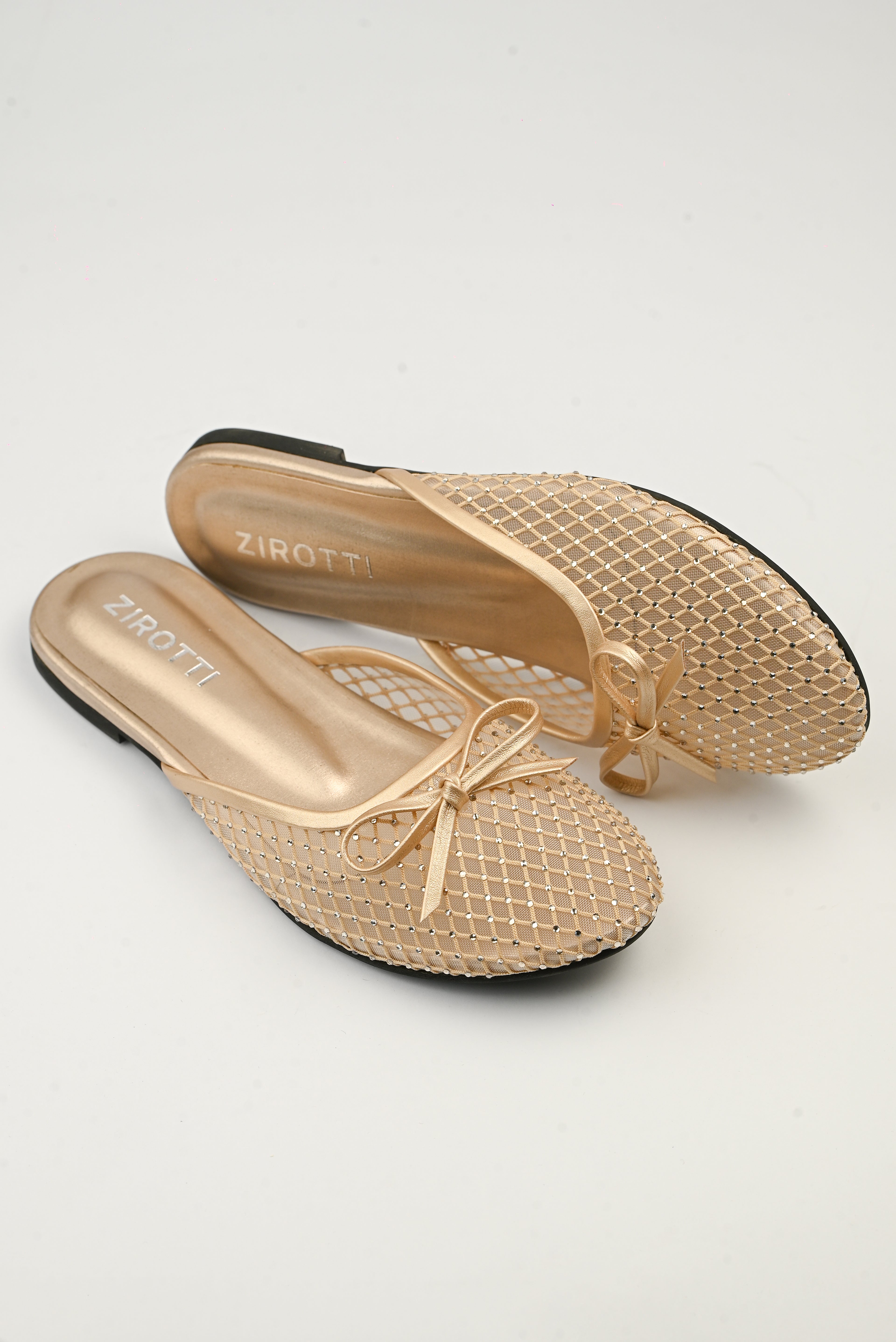 Lunara Gold women’s flat shoes with open design, cushioned insole, and stylish gold finish.