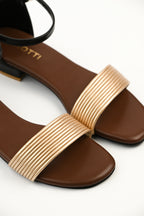 Zirotti LUNIQ women’s gold open-toe sandal with ankle strap and cushioned insole.