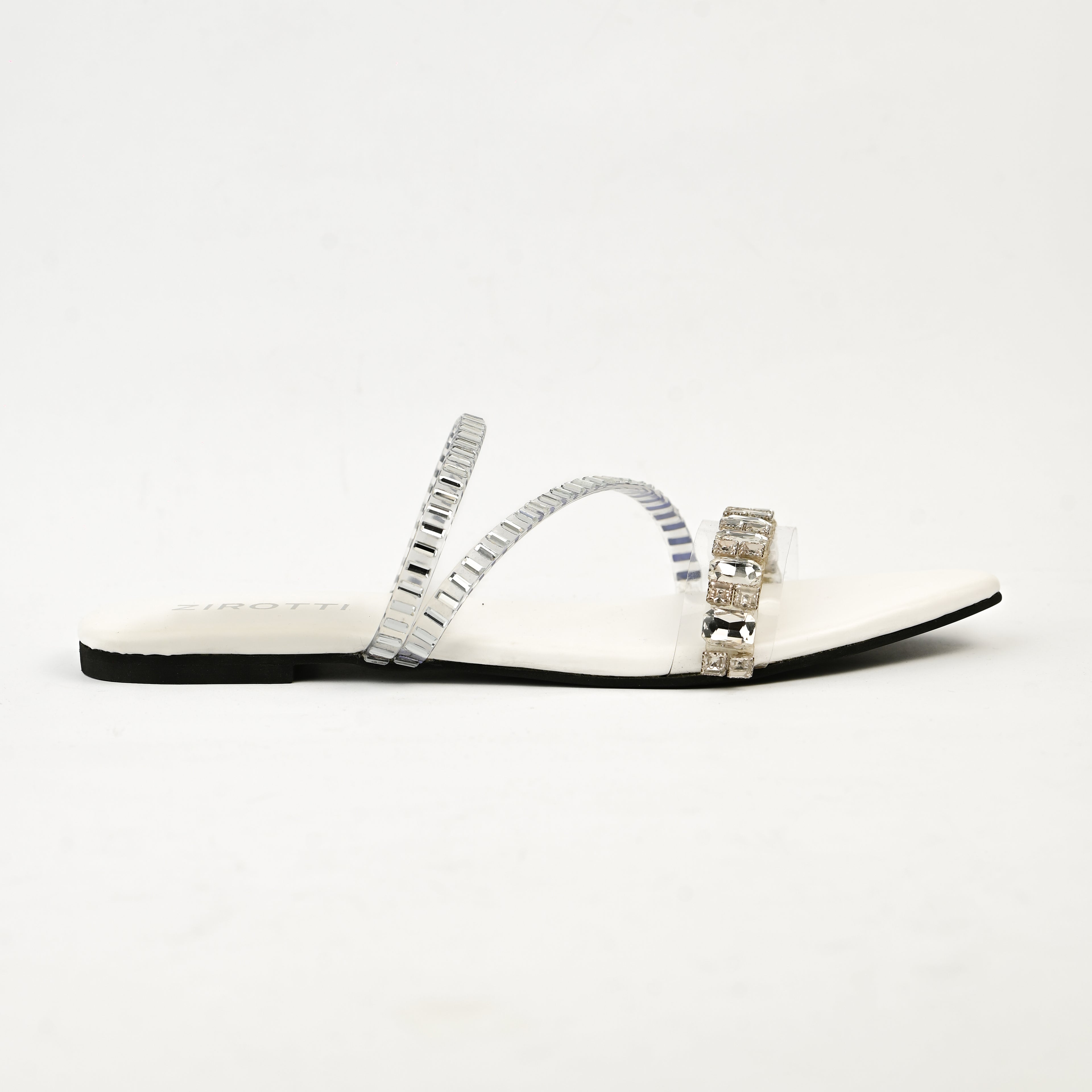 Orvia White women’s flat shoes with stylish stone detailing and comfortable sole.