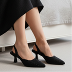 Vyana Black Heel – elegant black sandal featuring a sleek heel, glossy finish, and refined feminine silhouette, designed for formal events and evening wear.