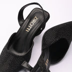 Vyana Black Heel – elegant black sandal featuring a sleek heel, glossy finish, and refined feminine silhouette, designed for formal events and evening wear.