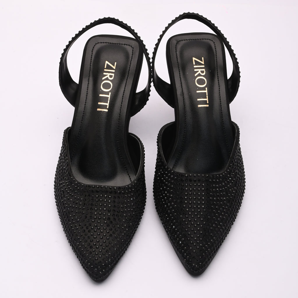 Vyana Black Heel – elegant black sandal featuring a sleek heel, glossy finish, and refined feminine silhouette, designed for formal events and evening wear.