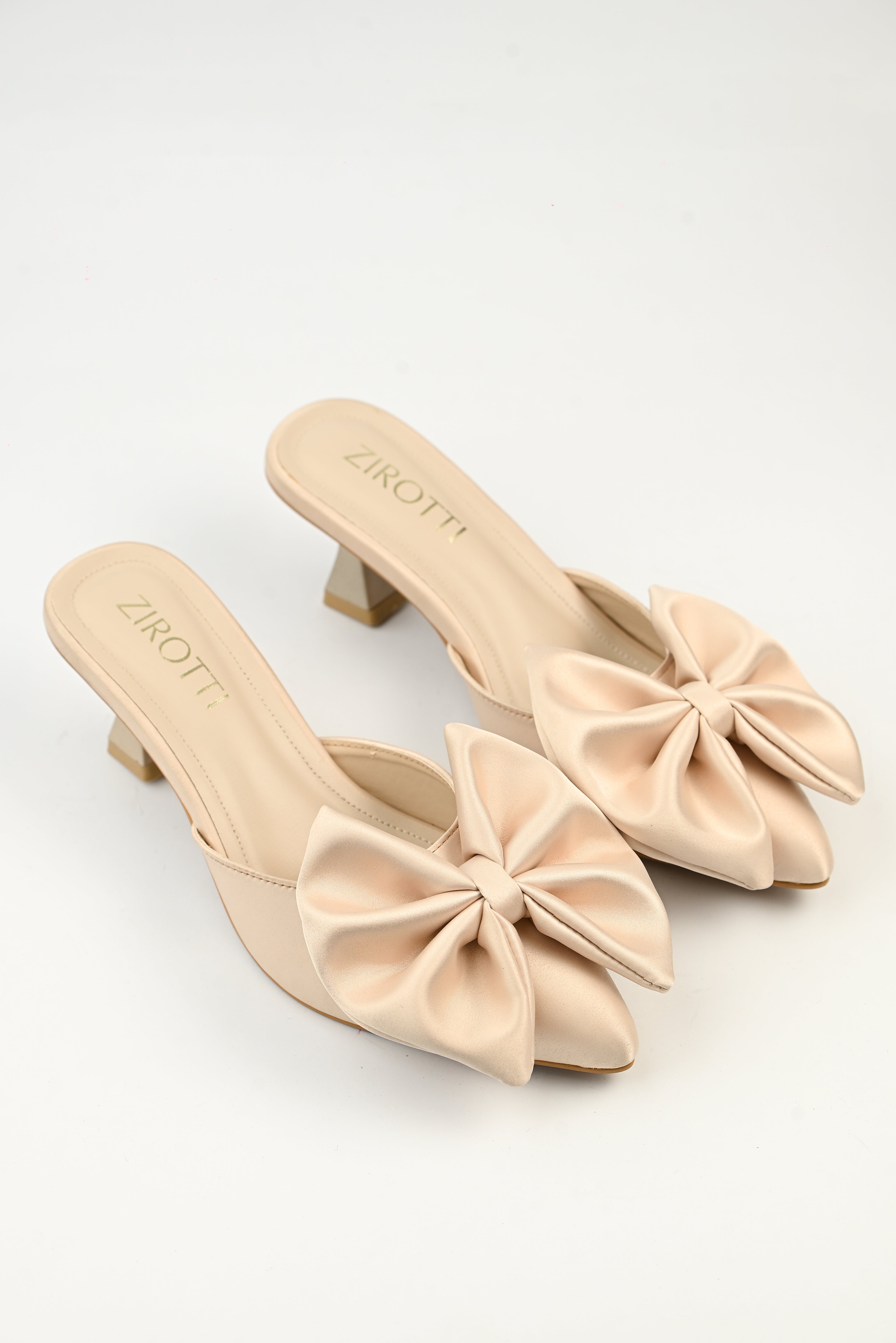 Women’s luxury fawn bow mule heels with soft cushioned insole, lightweight breathable design, and anti-slip sole.